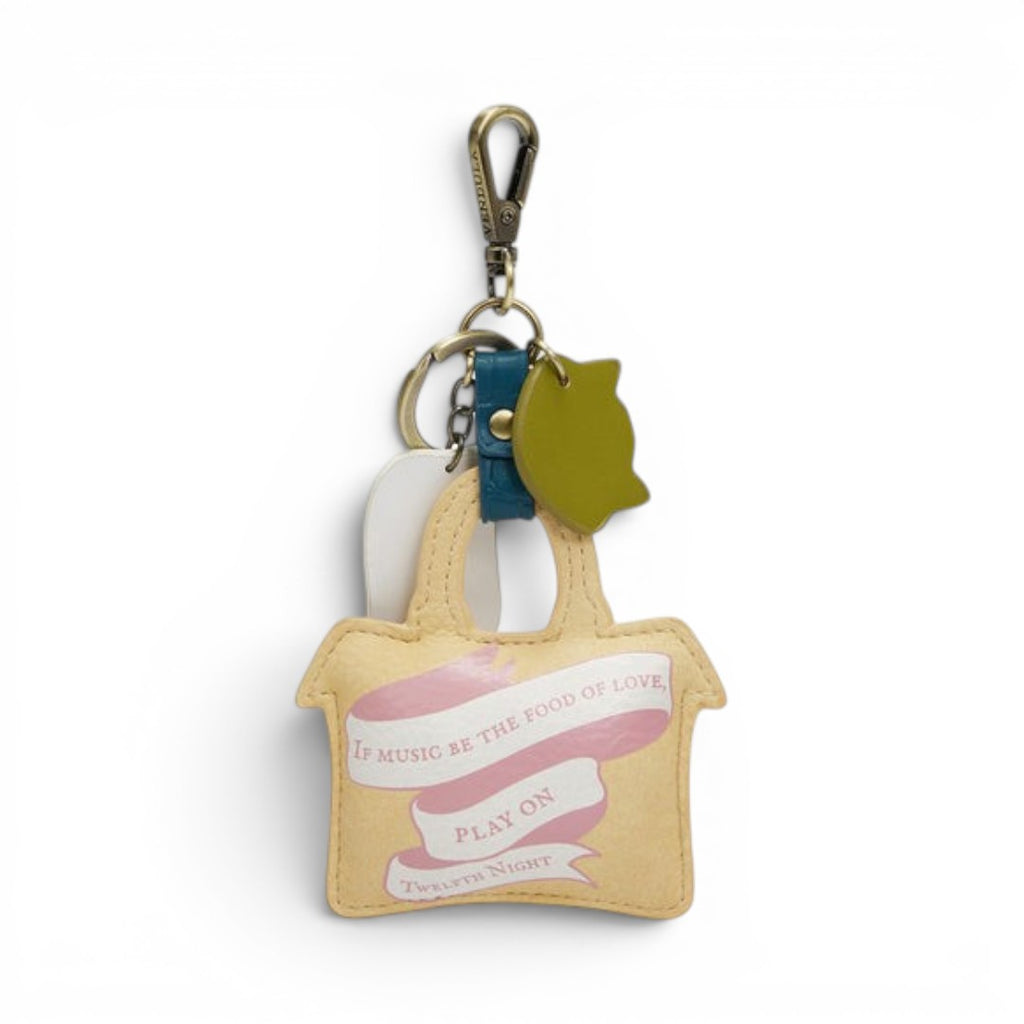 The Happy Shoe Shop Vendula London Shakespeare's Twelfth Night key charm in vegan leather, featuring a yellow tote bag design with a pink ribbon and text.