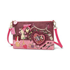 The Happy Shoe Shop Vendula London sewing box scrapbook bag in pink vegan leather with intricate craft-themed details.