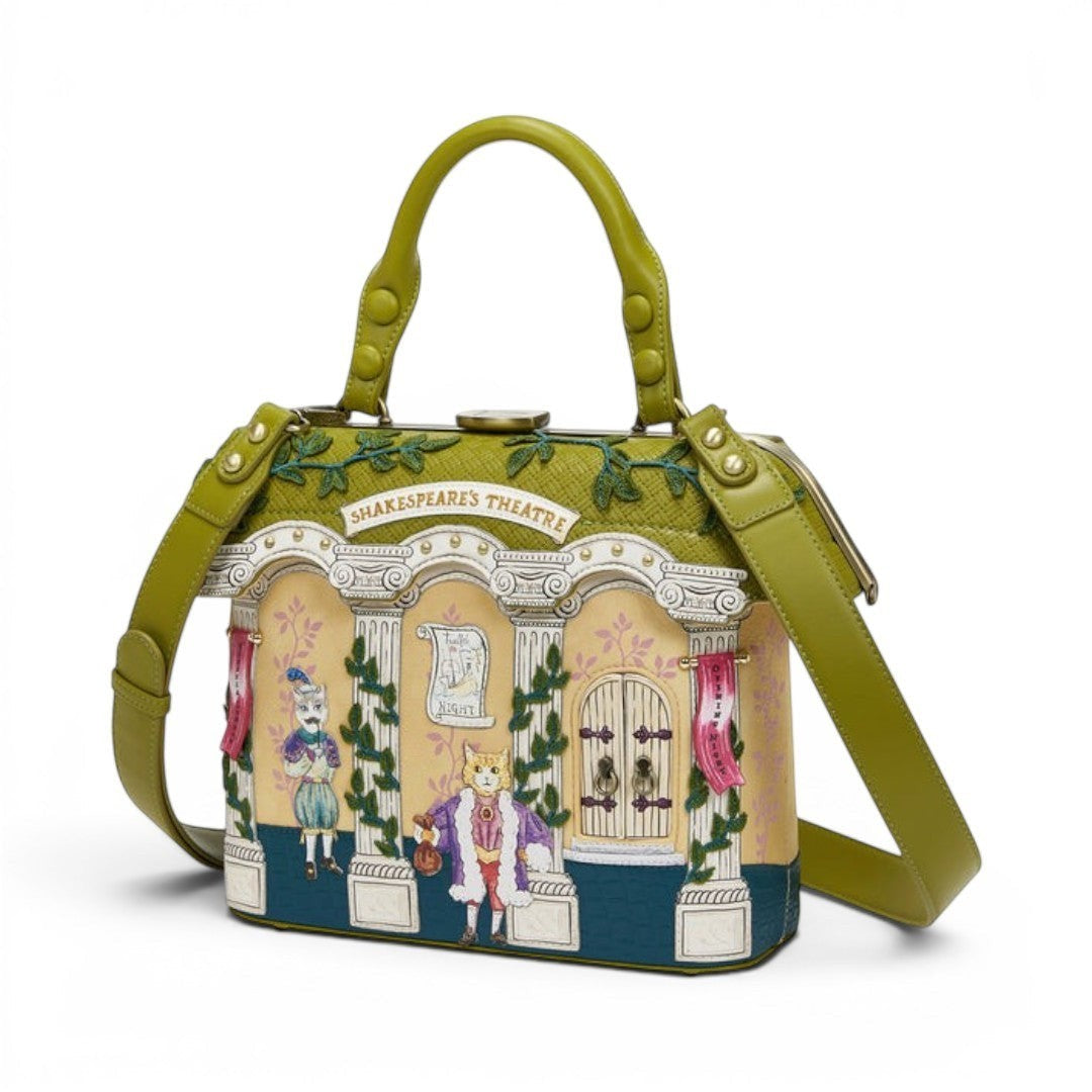 The Happy Shoe Shop Vendula London Shakespeare's Theatre Twelfth Night grab bag is made of vegan leather with a theatre facade design, featuring cats in costume. It has a green handle and strap.