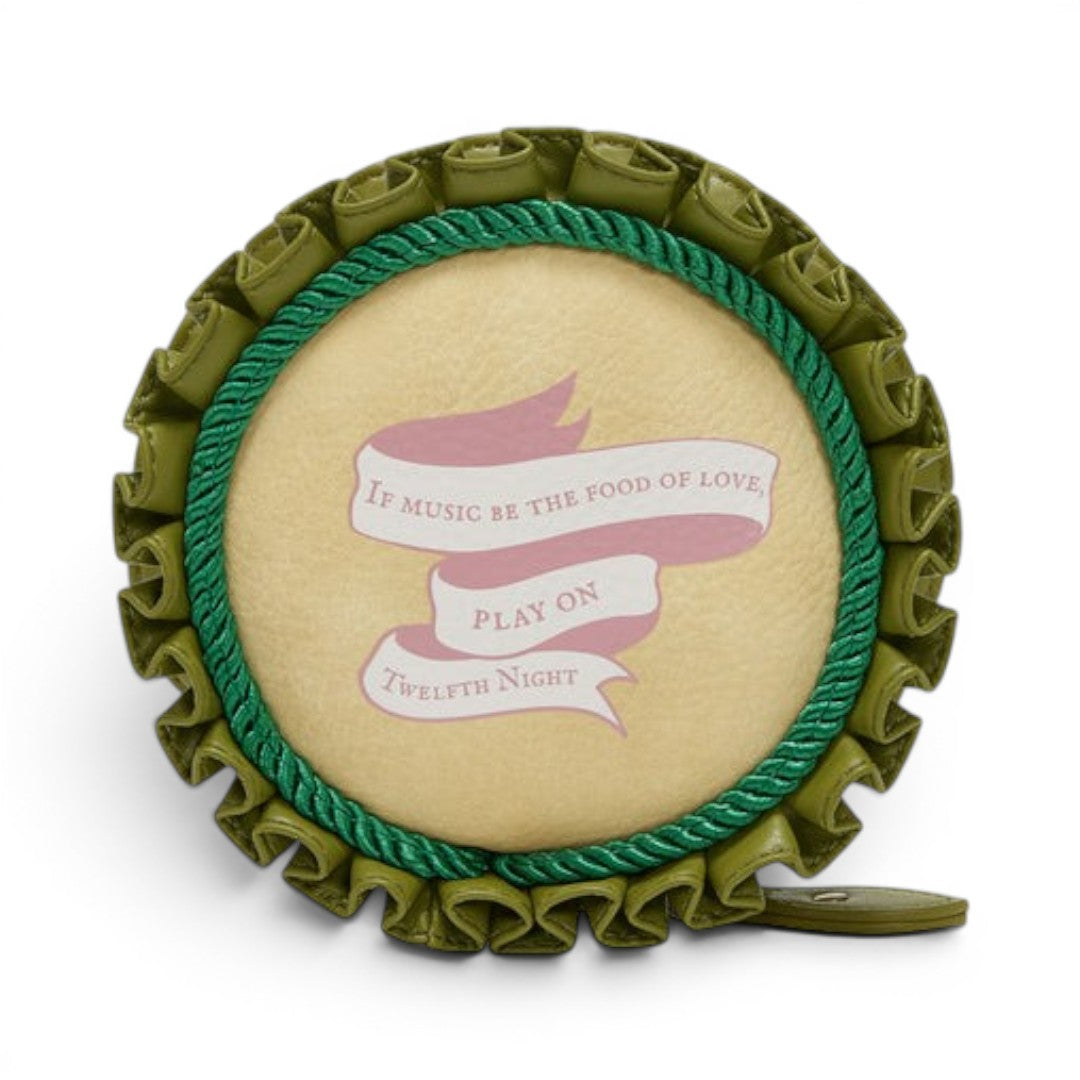 The Happy Shoe Shop Vendula London Shakespeare's Twelfth Night round coin purse in light tan vegan leather with green trim and pink ribbon detail.