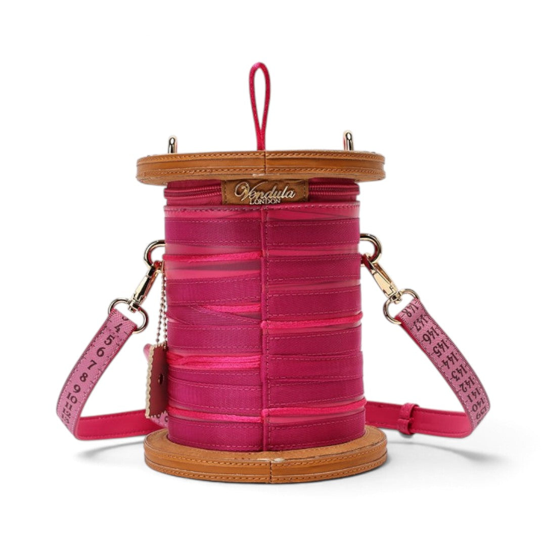 The Happy Shoe Shop Vendula London raspberry vegan leather sewing box bag with ribbon and measuring tape strap details.