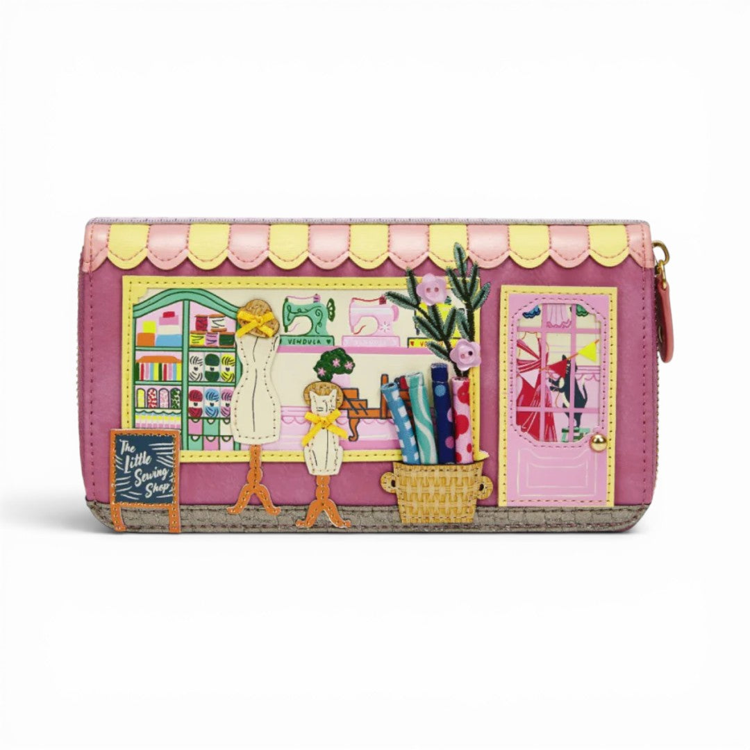 The Happy Shoe Shop Vendula London raspberry vegan leather ziparound wallet with sewing shop applique details.