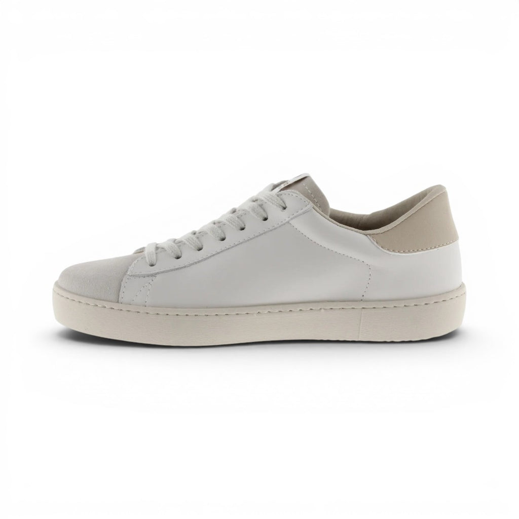 The Happy Shoe Shop Victoria Berlin white leather sneaker with a suede toe and V-shaped side detail.