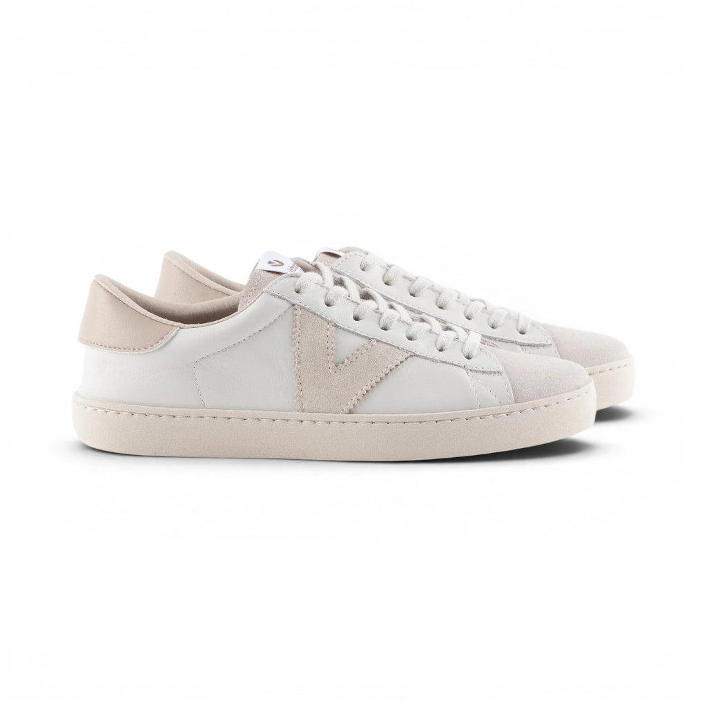 The Happy Shoe Shop Victoria Berlin sustainable white leather sneakers with beige suede accents and V-side detail.