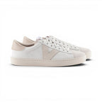 The Happy Shoe Shop Victoria Berlin sustainable white leather sneakers with beige suede accents and V-side detail.