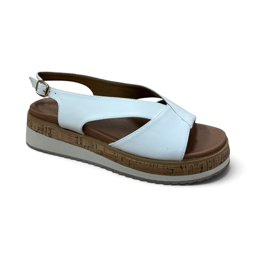 The Happy Shoe Shop Bay Lane Lacey white platform sandals with a criss-cross strap, slingback, and cork-look sole.