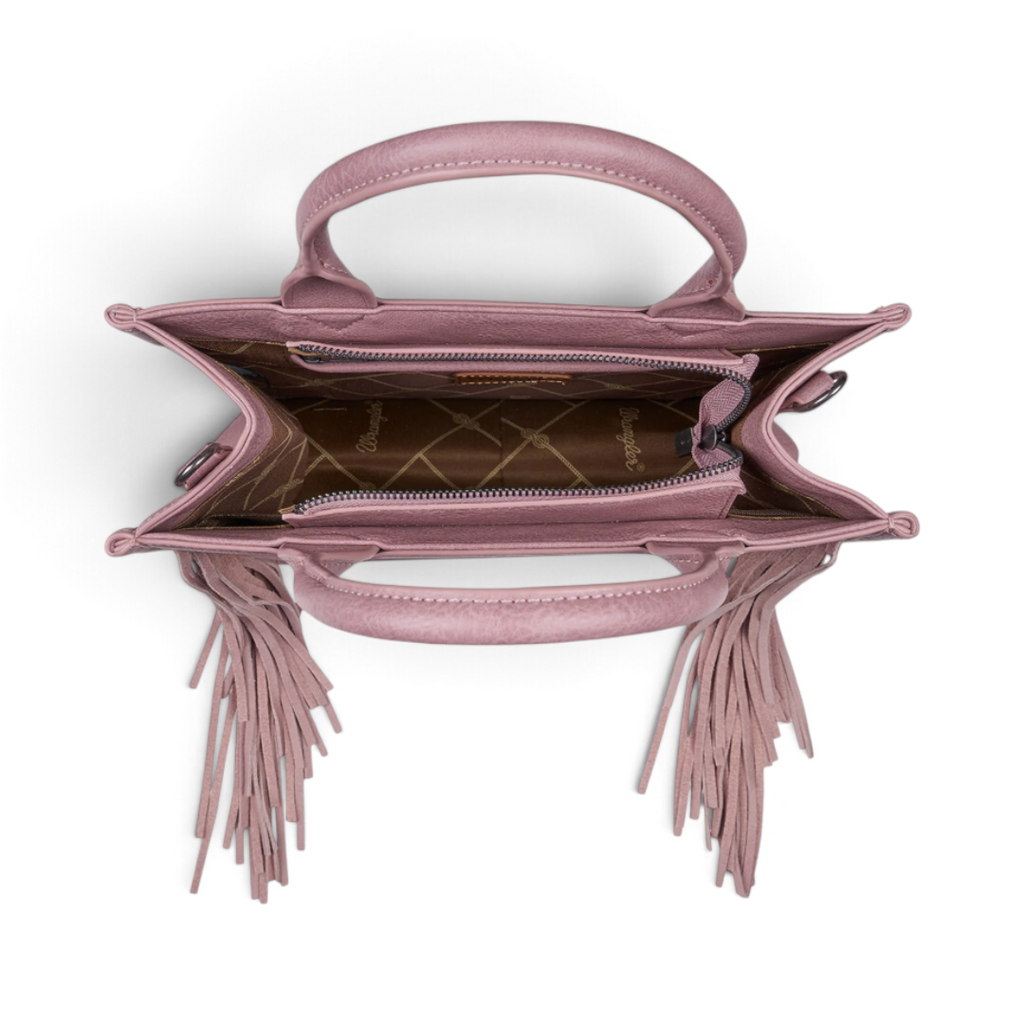 Top view of The Happy Shoe Shop Wrangler Adelyn bag in dusty pink with suede fringe and branded interior lining