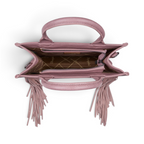 Top view of The Happy Shoe Shop Wrangler Adelyn bag in dusty pink with suede fringe and branded interior lining