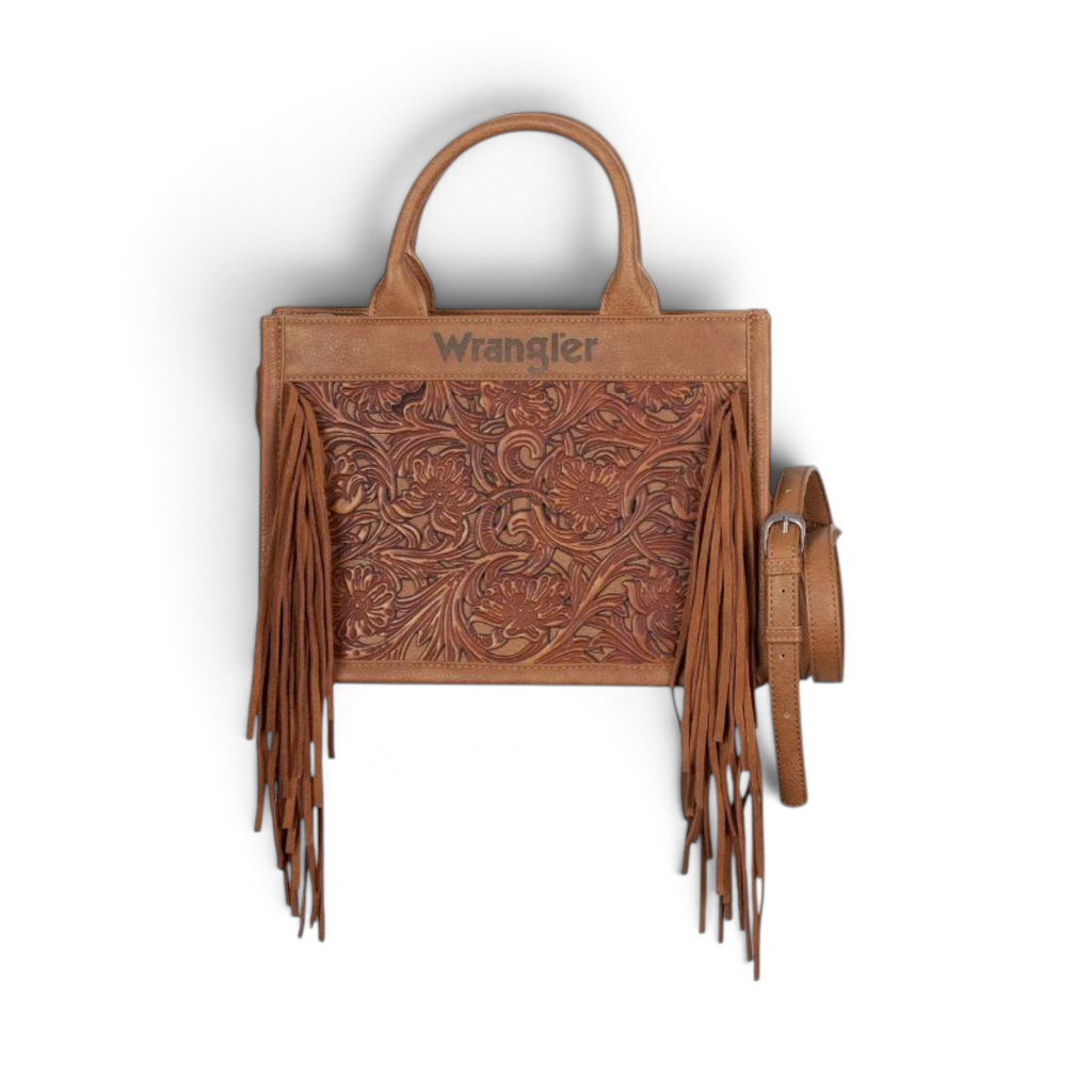 The Happy Shoe Shop Wrangler Adelyn bag in tan leather with tooled floral front, side suede fringe, and top handles.