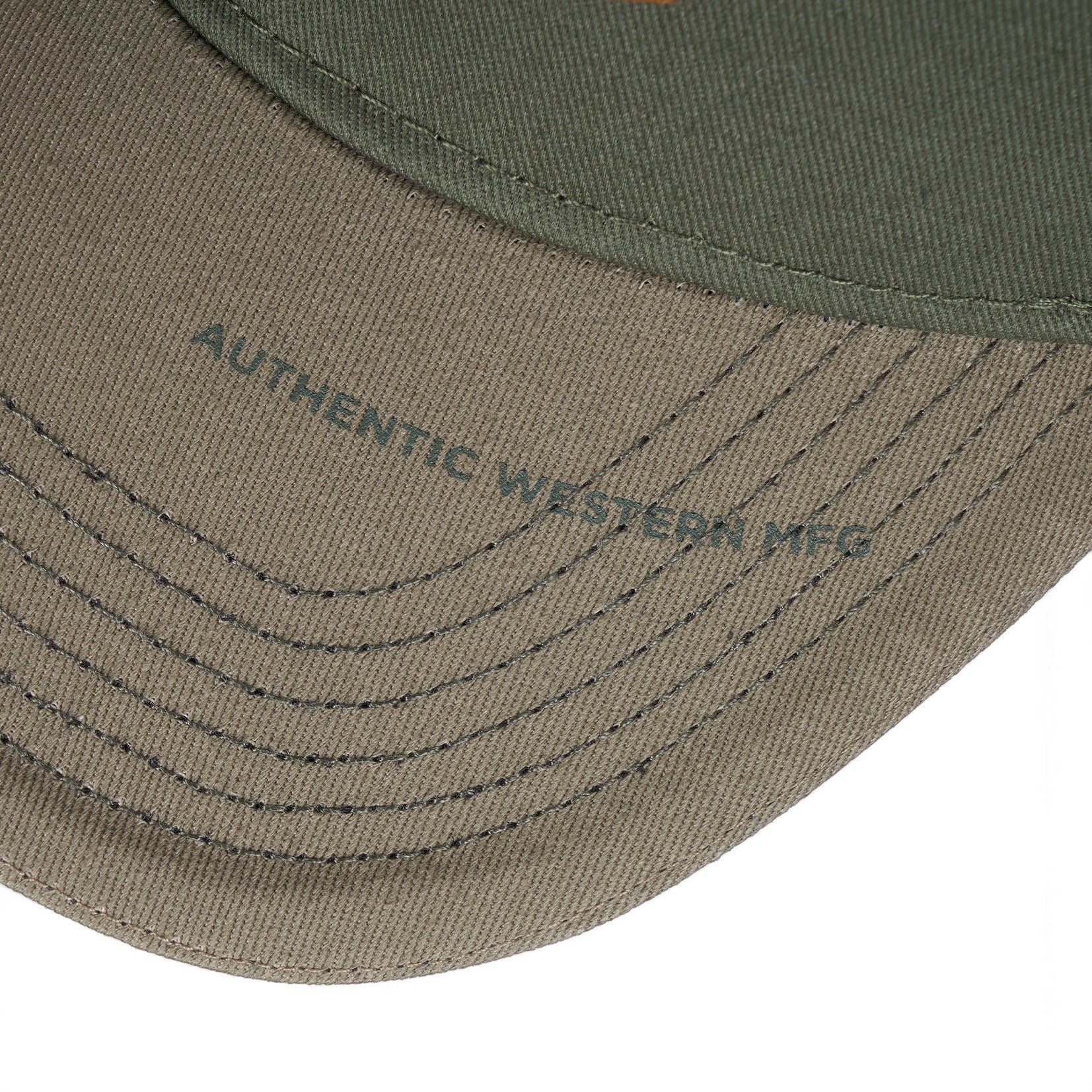 The Happy Shoe Shop Wrangler Fritz cap featuring olive green cotton fabric and contrast stitching on the curved peak.